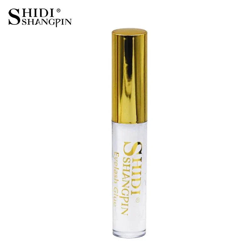 Clear eyelash glue with gold cap by SHIDI SHANGPIN for makeup application