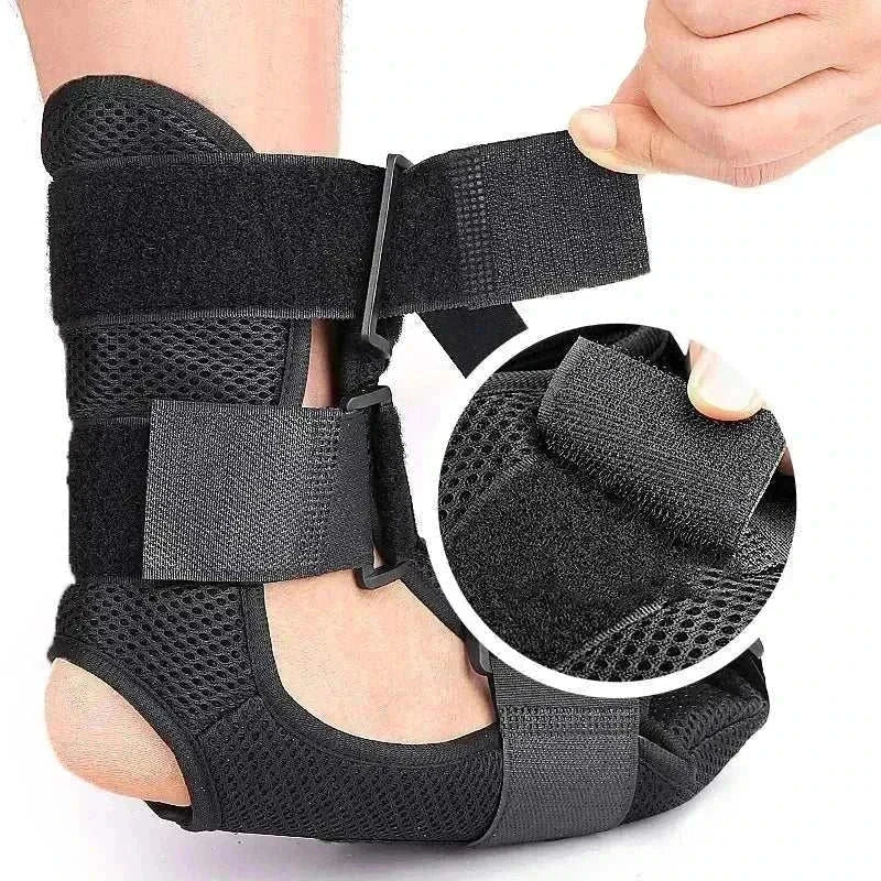 Adjustable black night splint for plantar fasciitis with breathable fabric and secure straps promoting heel and arch support.
