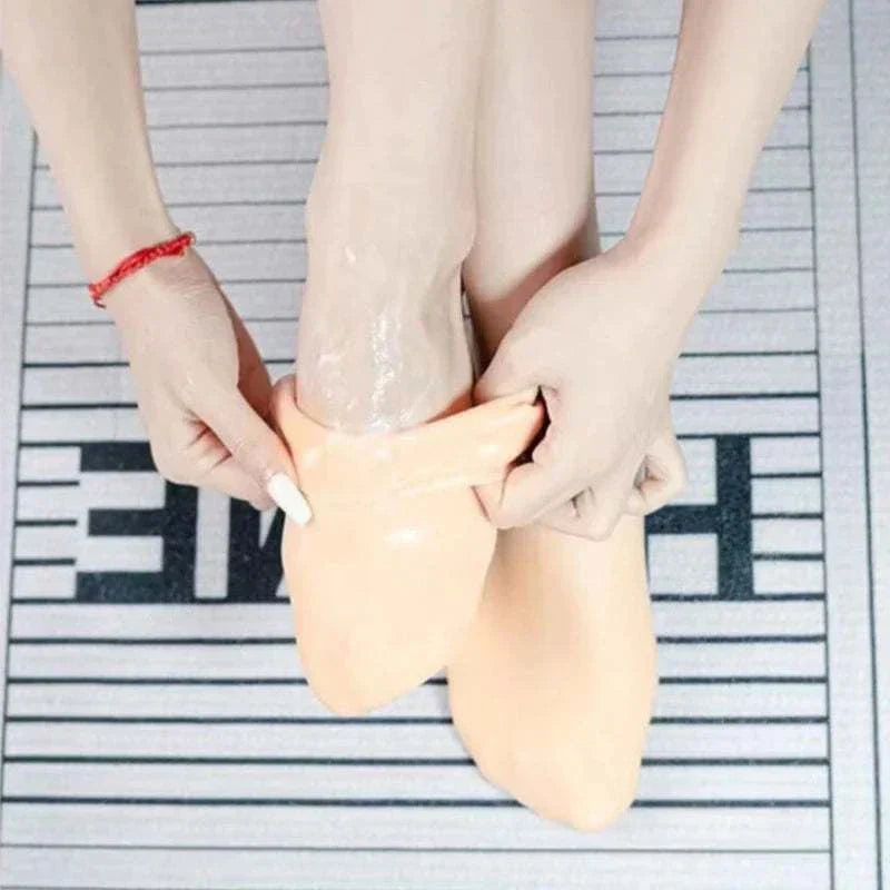 Person wearing Universal Silicone Foot Repair Foot Mask for deep hydration and foot skin repair