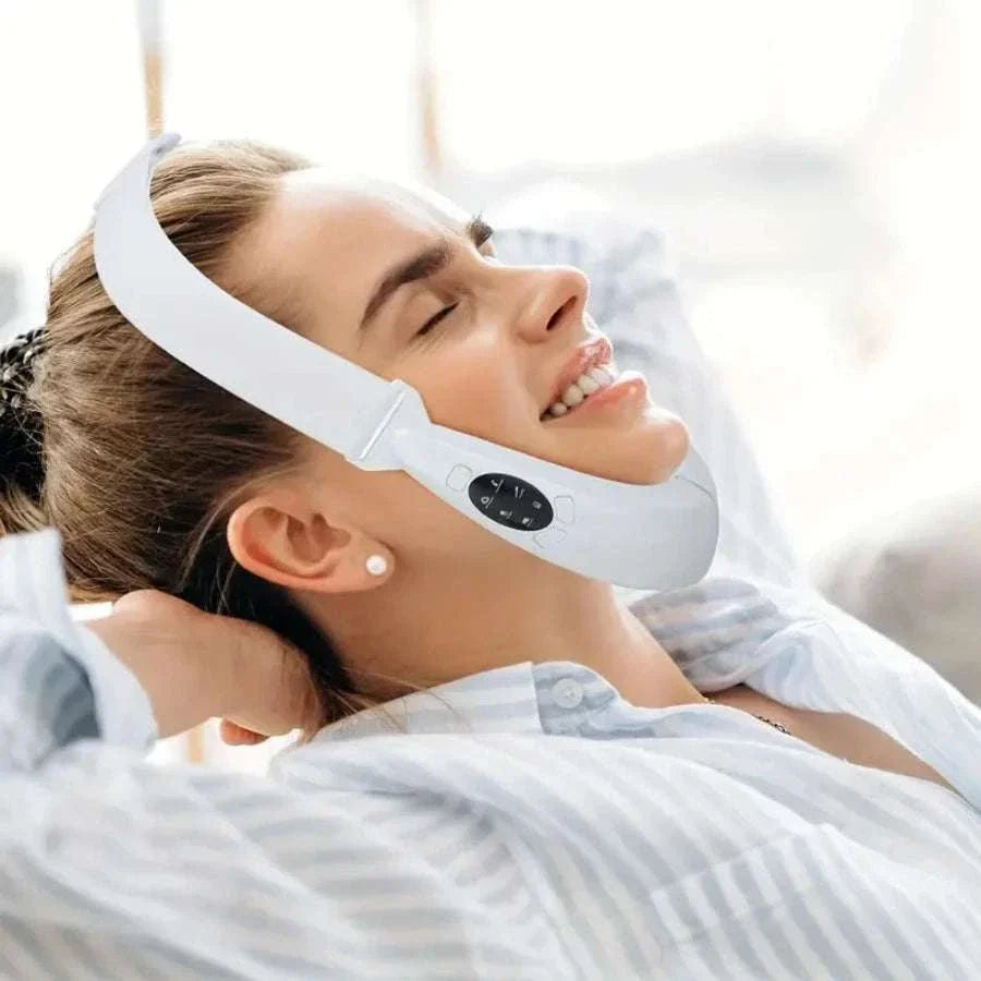 Woman using rechargeable V Line Face Lift massager with LED display and multiple modes for facial contouring and skin care