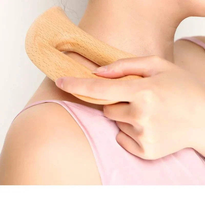 Wooden Gua Sha Tool being used on shoulder for massage and cellulite reduction therapy