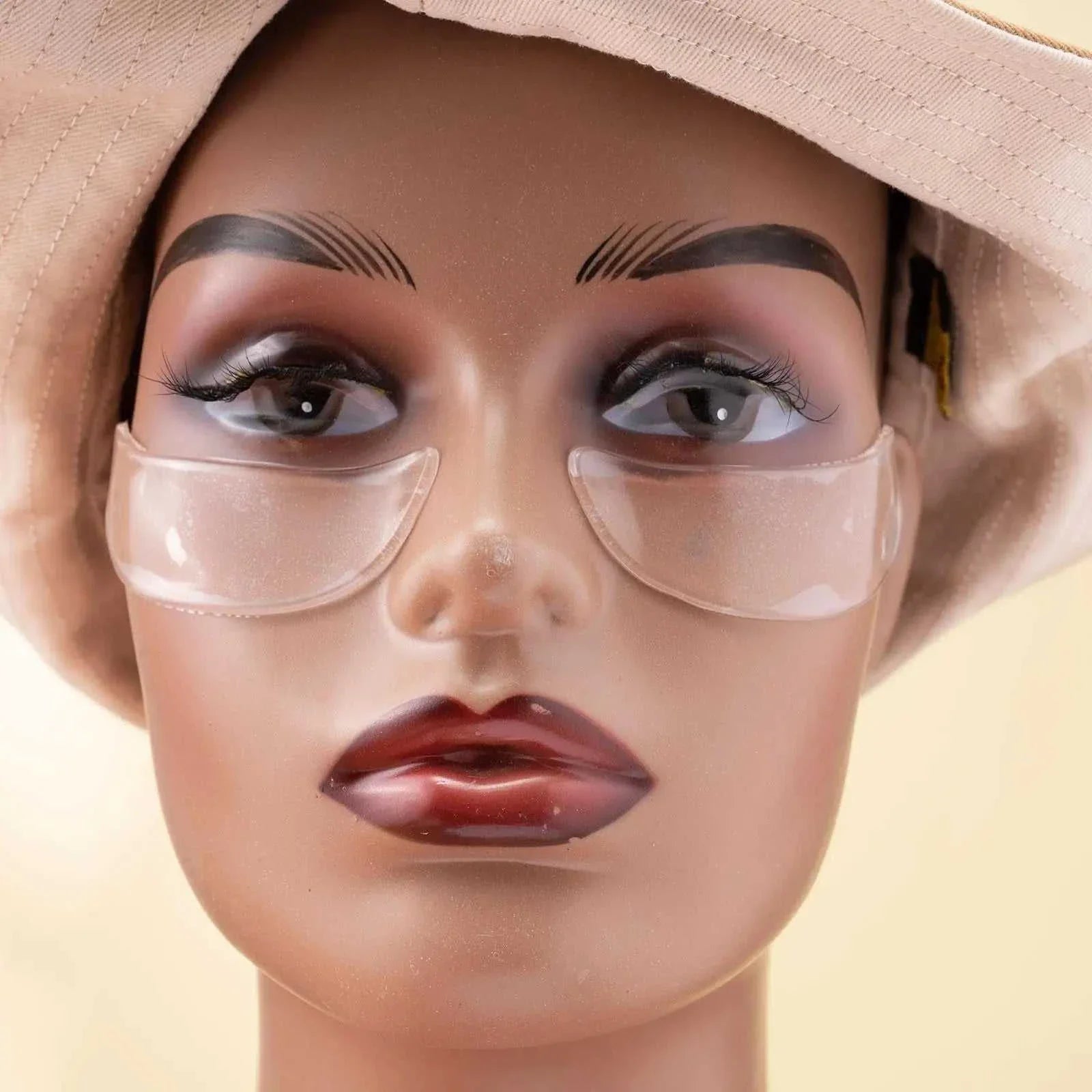 Reusable anti-wrinkle forehead patch applied on a mannequin face for smooth skin treatment