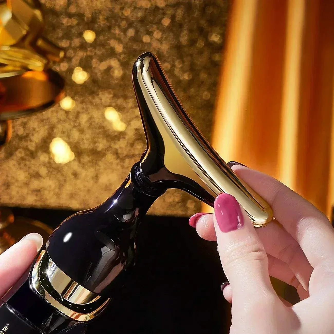 3-in-1 Facial Lifting Device handheld beauty tool for neck, face, and eye massage with a sleek black and gold design