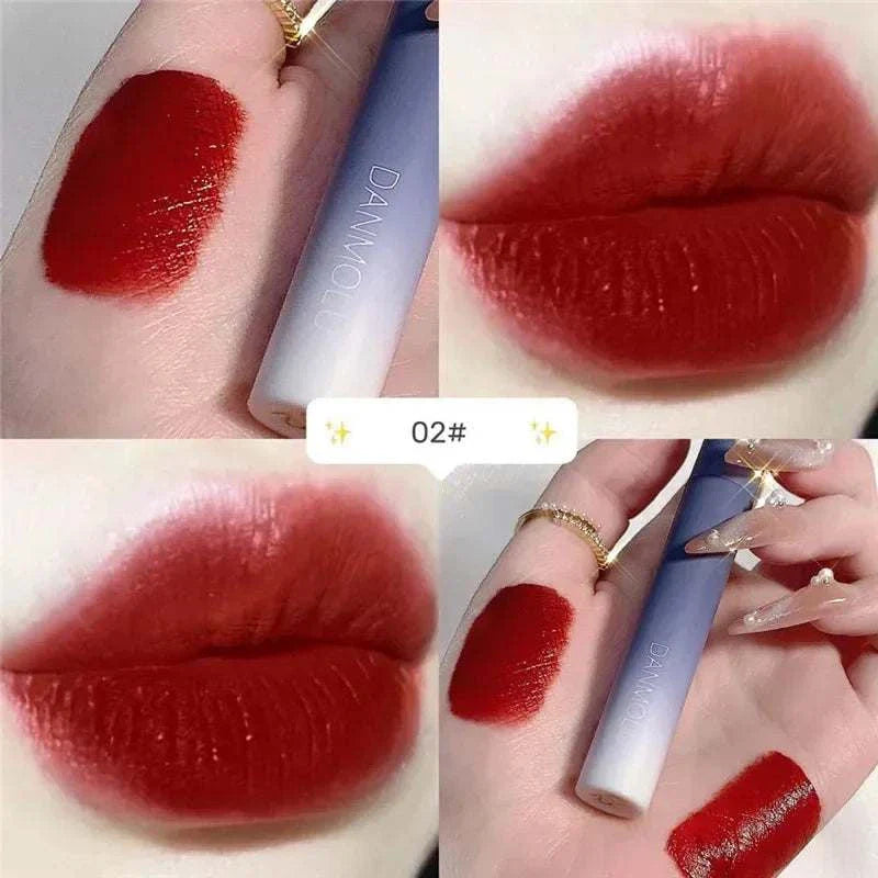 Matte Lipstick Set swatch and application showing deep red shade with smooth, velvety finish on lips and hand.