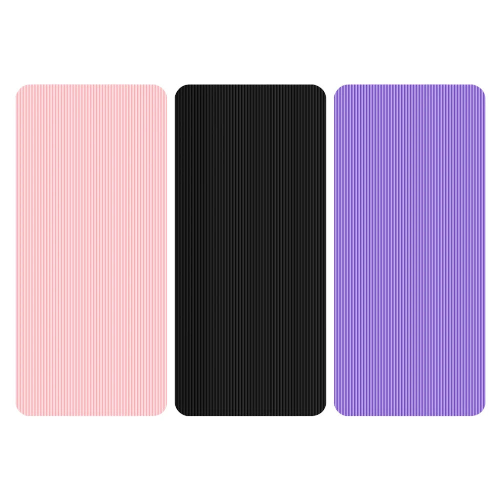 Set of non-slip yoga mats in pink, black, and purple with textured surface for grip and stability