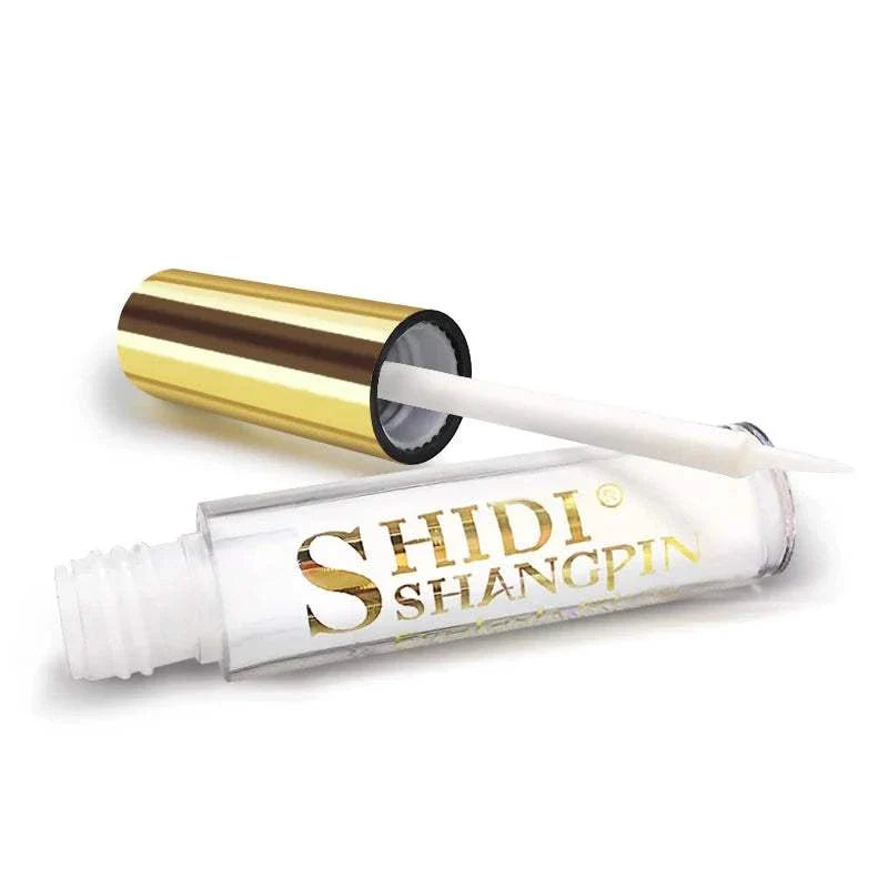 Clear glitter eyeshadow glue with gold cap for shimmering eye makeup application