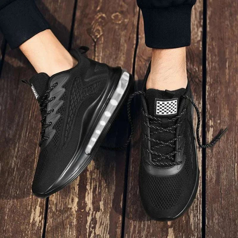Black breathable unisex sneaker with vulcanized rubber sole, lightweight mesh upper, lace-up closure, and cushioned insole for comfort and all-day wear.