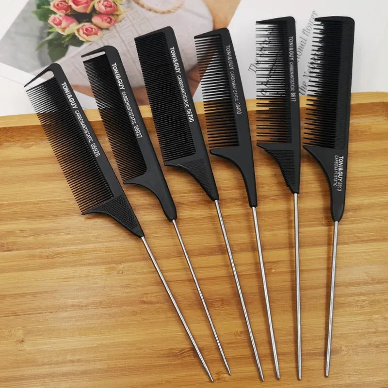 Set of professional hair tail combs with stainless steel tails and fine teeth on wooden surface