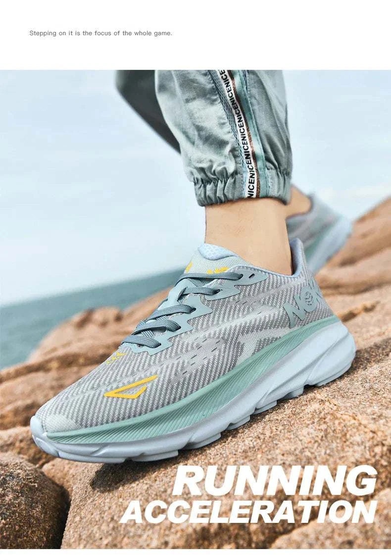 Unisex gray carbon plate air cushion running shoe with breathable mesh upper and durable rubber outsole on rocky terrain
