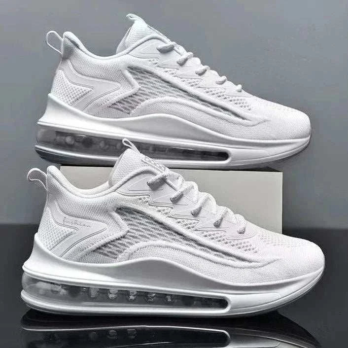 White men's casual air cushion running shoes with breathable mesh upper and flexible soles stacked on a box.