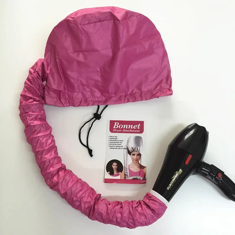 Portable Hair Bonnet Dryer Cap with pink adjustable bonnet and hose attached to black handheld hair dryer for quick drying and deep conditioning at home