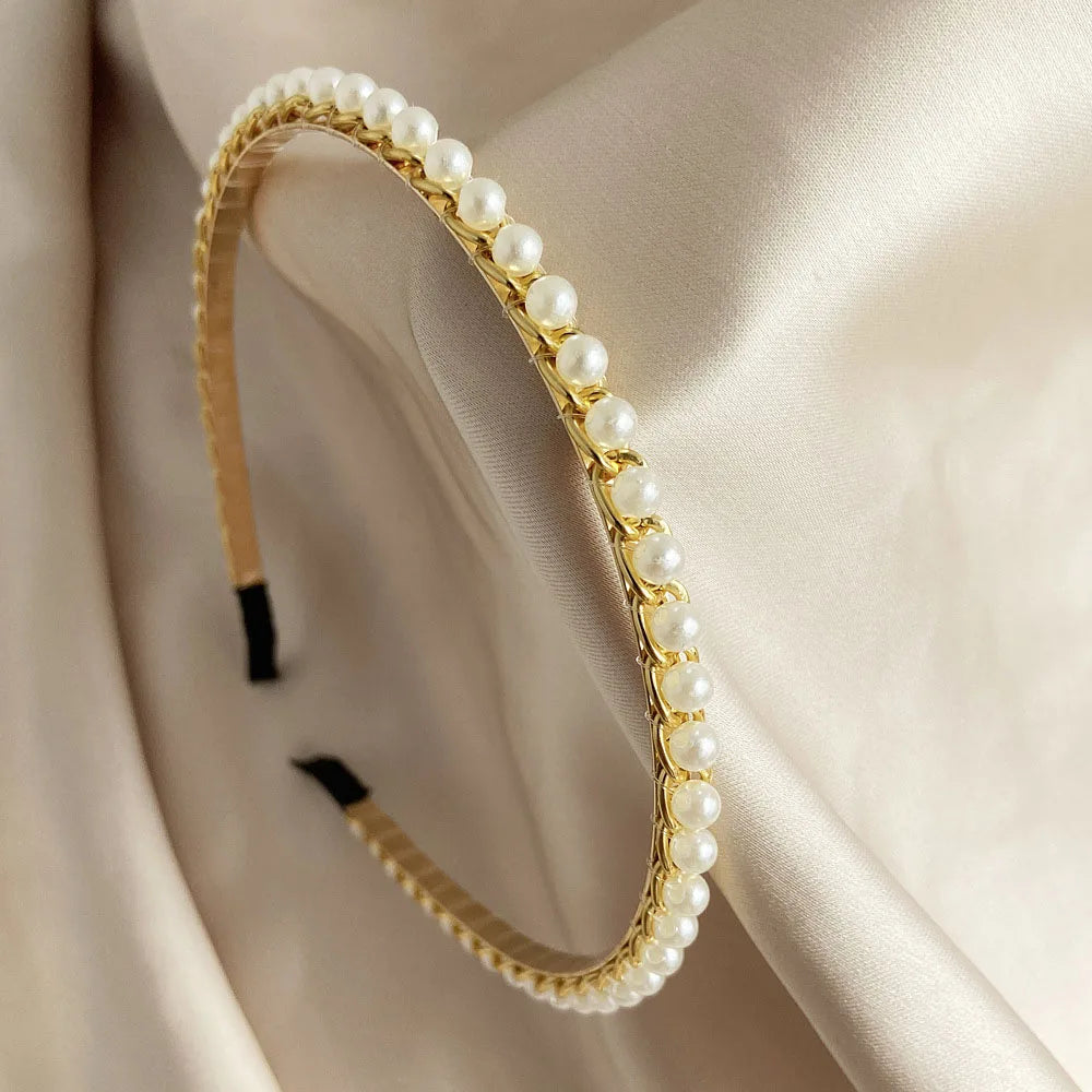 Modyle Full Pearl Hairband with elegant floral pearl design and elastic fit on satin background