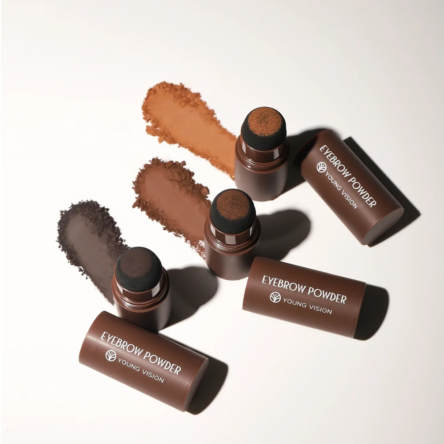 Eyebrow Stamp Powder in three shades with sponge applicators for easy, smudge-resistant brow shaping