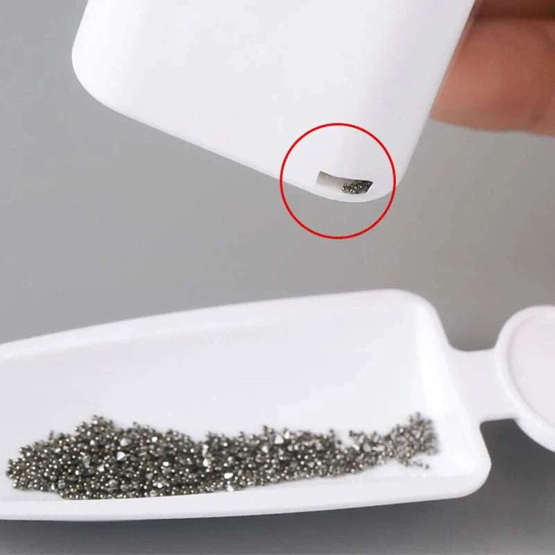 White double-layer storage container collecting small nail art rhinestones for glitter recycling and organization