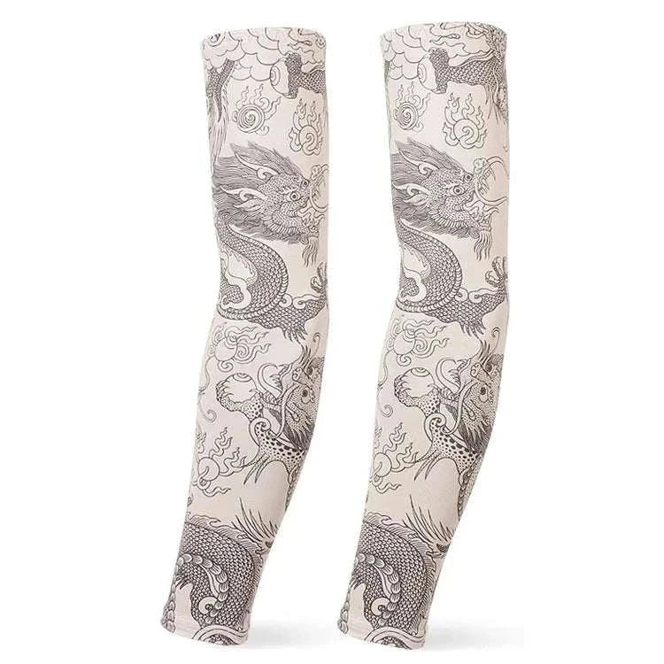 Pair of beige outdoor arm sleeves with black dragon tattoo design for UV protection and compression