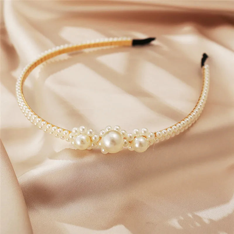 Modyle full pearl elastic hairband with elegant floral pearl design on satin background