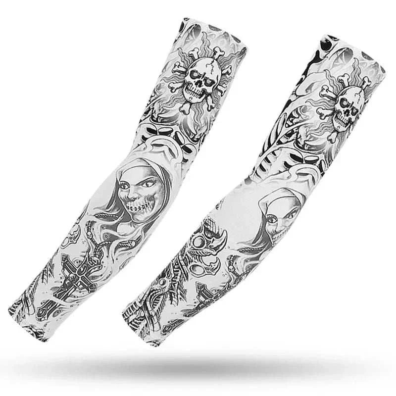 Pair of white outdoor arm sleeves with black tattoo-style skull and character designs for UV protection and muscle support
