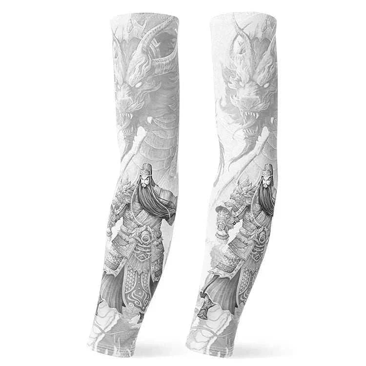 Pair of white outdoor arm sleeves with black and gray detailed warrior and dragon tattoo designs, providing UV protection and compression for sports and outdoor use.