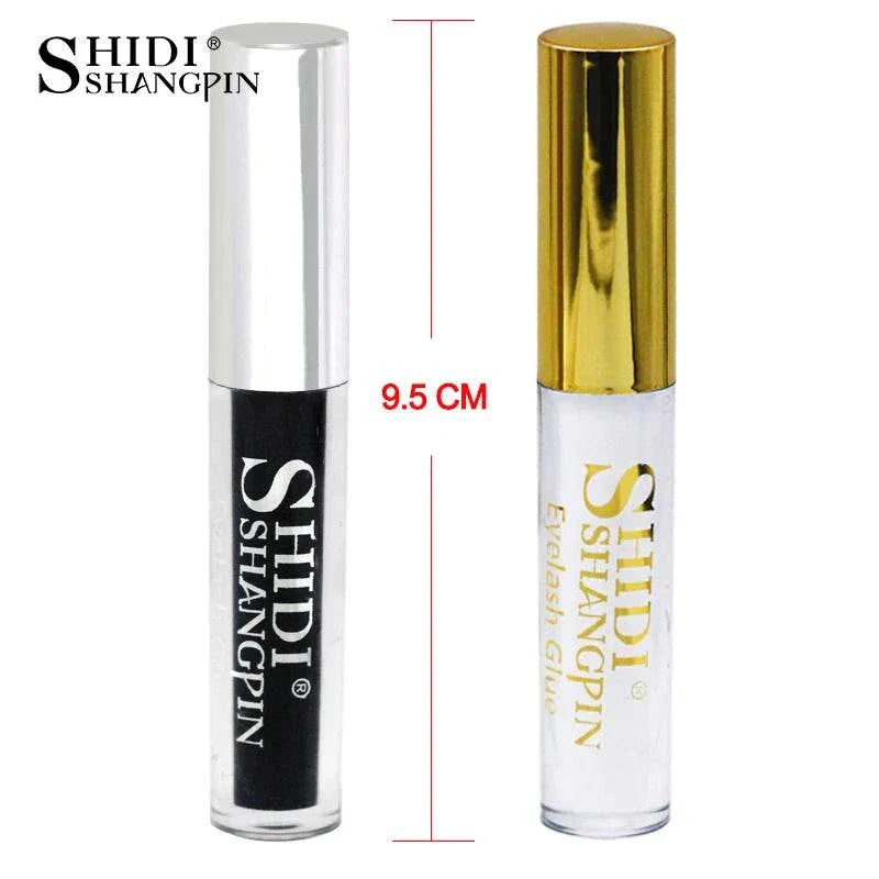 Two SHIDI SHANGPIN eyelash glue tubes with silver and gold caps, each 9.5 cm tall.