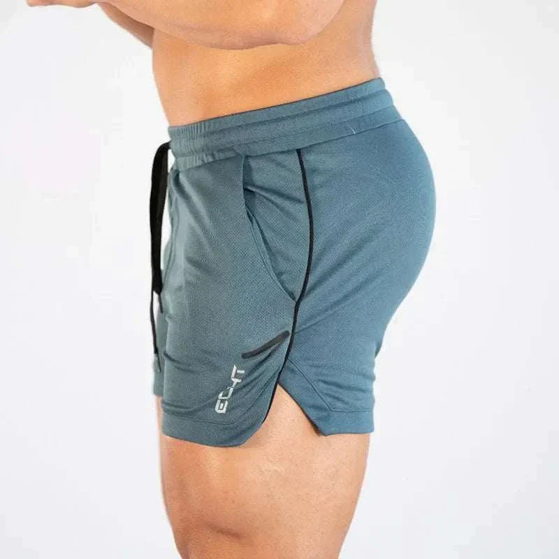 Men’s gym training shorts in blue with elastic waistband and side logo, designed for breathable comfort and flexibility during workouts