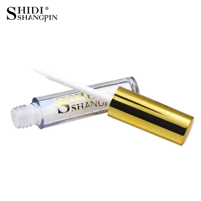 Clear glitter eyeshadow palette gloss with gold cap and applicator wand