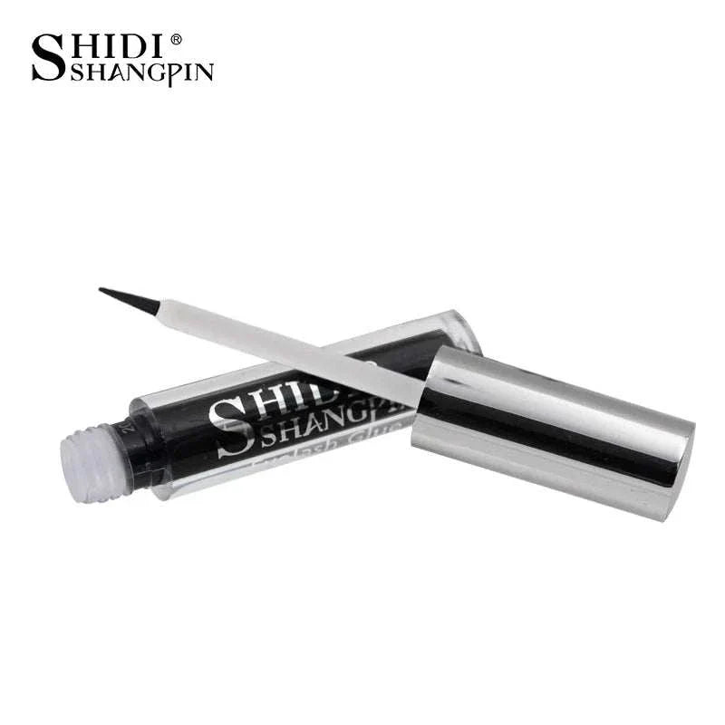 black liquid eyeliner with silver cap and brush applicator isolated on white background