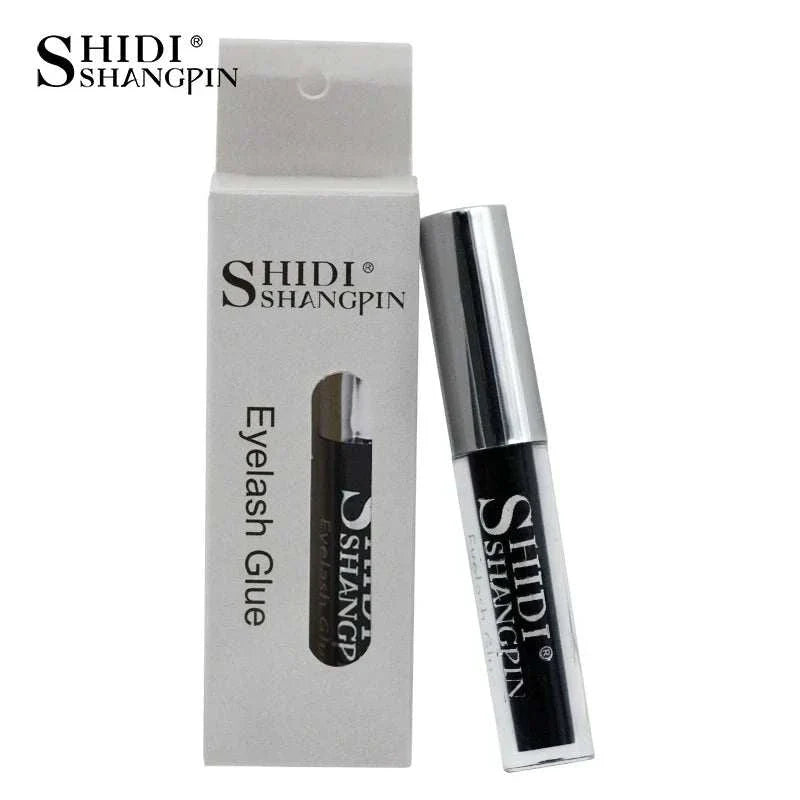 Black eyelash glue in silver-capped tube with white box packaging by Shidi Shangpin