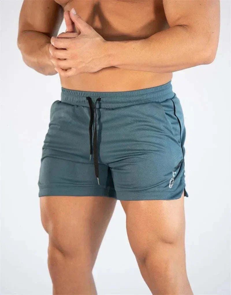 Men’s gym training shorts in breathable fabric with elastic waistband and drawstring for adjustable fit.