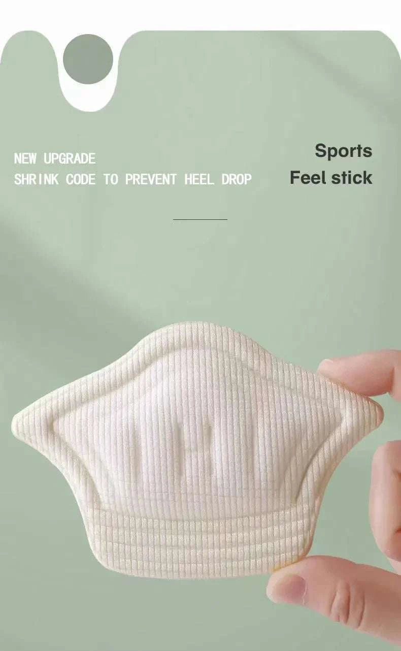 Soft beige heel cushion pad for sports shoes with adhesive backing to prevent heel drop and improve comfort.