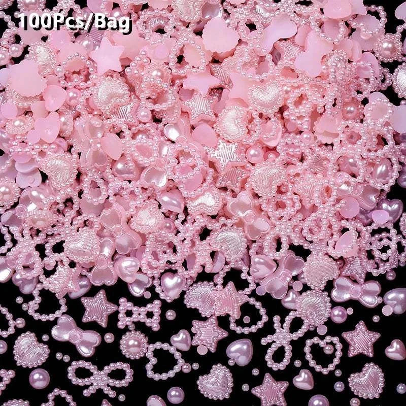 Pink pearl-like rhinestones and nail art decorations in various shapes for 3D nail design embellishments