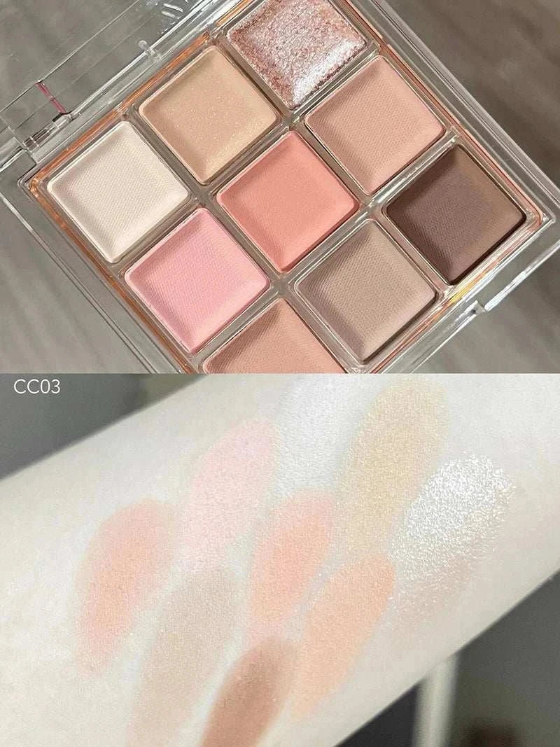 Black Pink Smoky Eye shadow palette with pearlescent matte chocolate tones swatched on arm