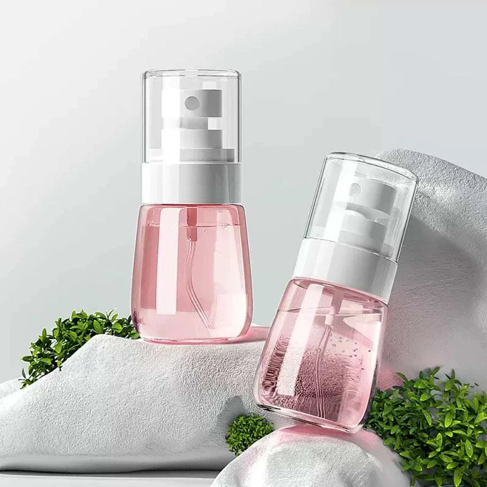 30ml mini travel spray bottle with clear cap and fine mist nozzle, refillable and leak-proof for face, hair, sanitizer, and plant care.