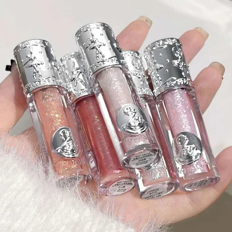 Set of Balletism Liquid Eyeshadow tubes with fine shimmer in iridescent colors, featuring elegant silver caps and delicate sparkling finish.