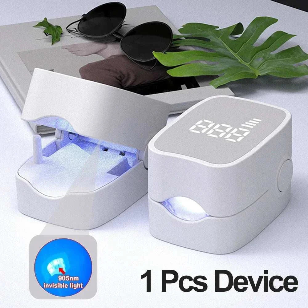Compact white nail care device with digital display and UV light for fungal treatment and nail repair.