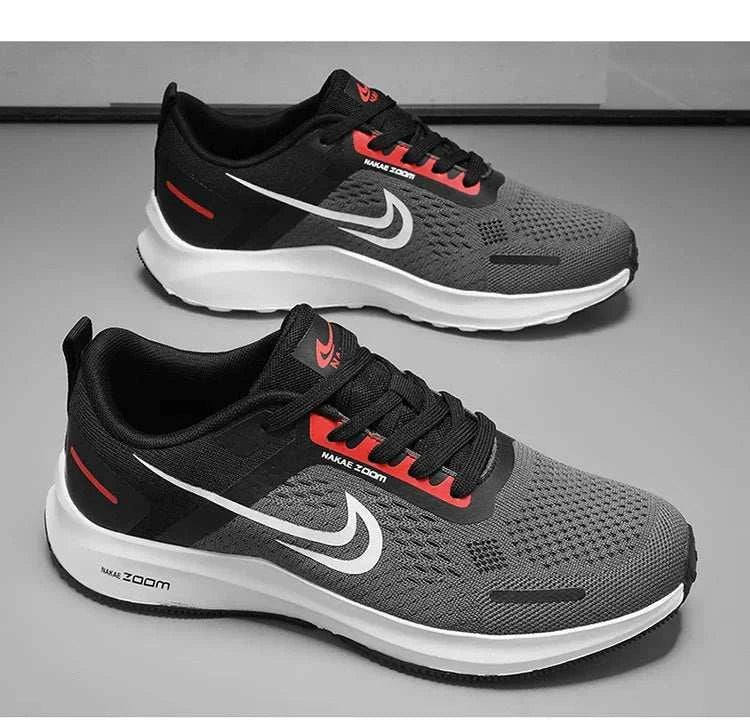 Men's lightweight running shoes in black and gray with breathable mesh, non-slip sole, and sporty design.