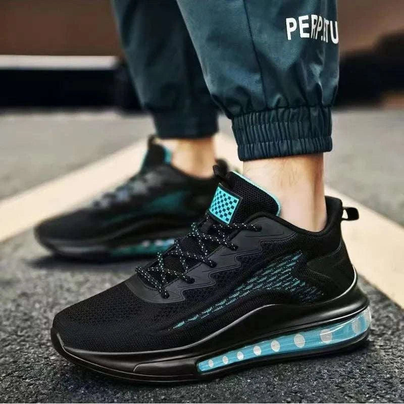 Black breathable unisex sneaker with cushioned sole and blue accents designed for comfort and versatile athletic use