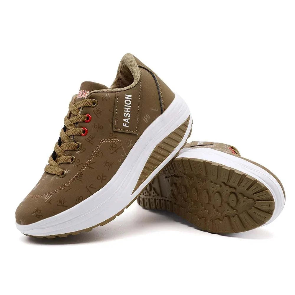 Brown breathable wedge heel sneakers with lace-up closure and thick cushioned sole for women