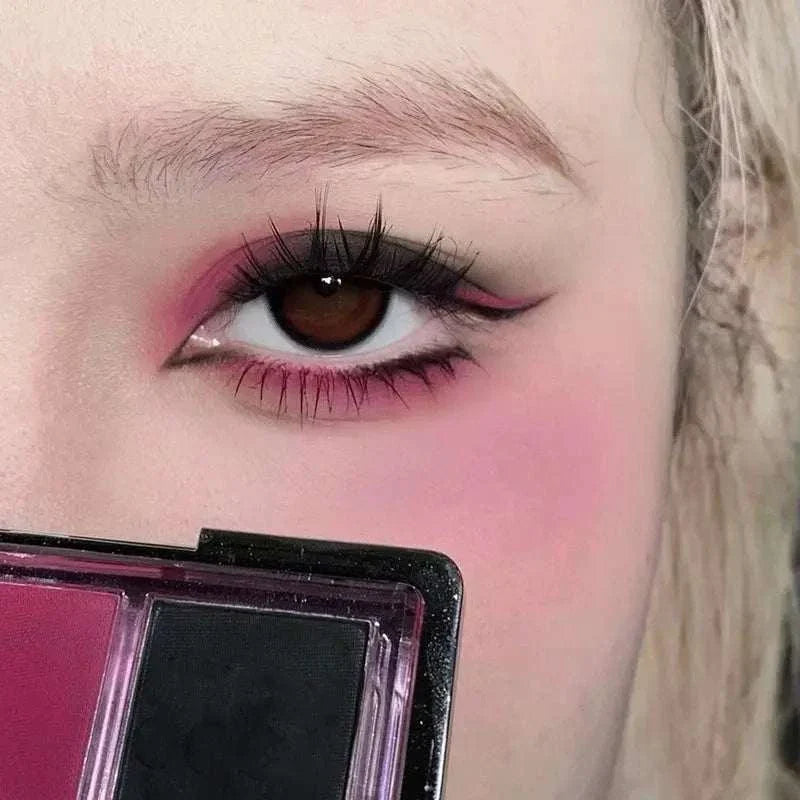 Close-up of an eye with pink eyeshadow applied, holding a 9 Colors Eyeshadow Palette featuring bold and blendable shades.