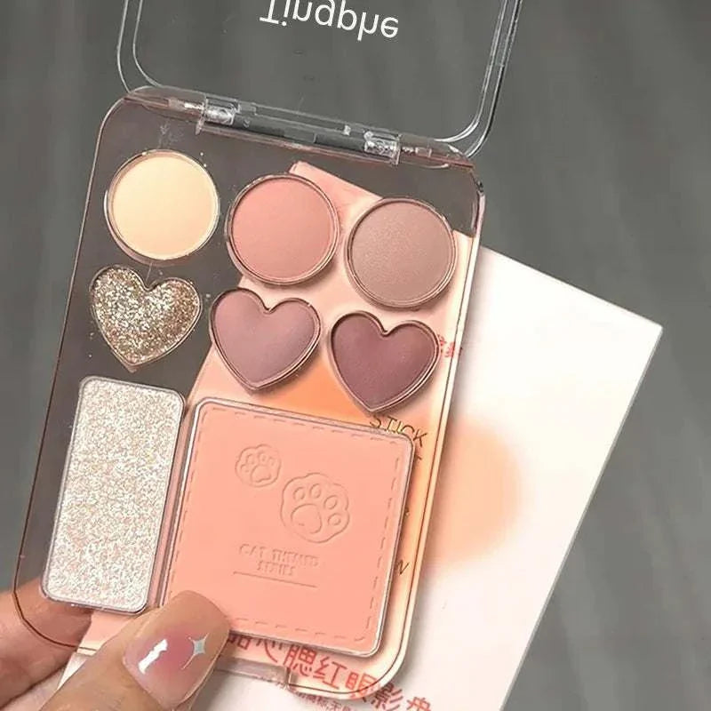 8-Color Pink Orange Eyeshadow Palette with heart-shaped blushers and shimmer highlighter in a clear compact case