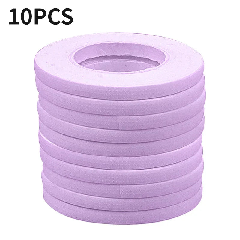Stack of 10 lavender micropore eyelash extension tapes for precise lash application