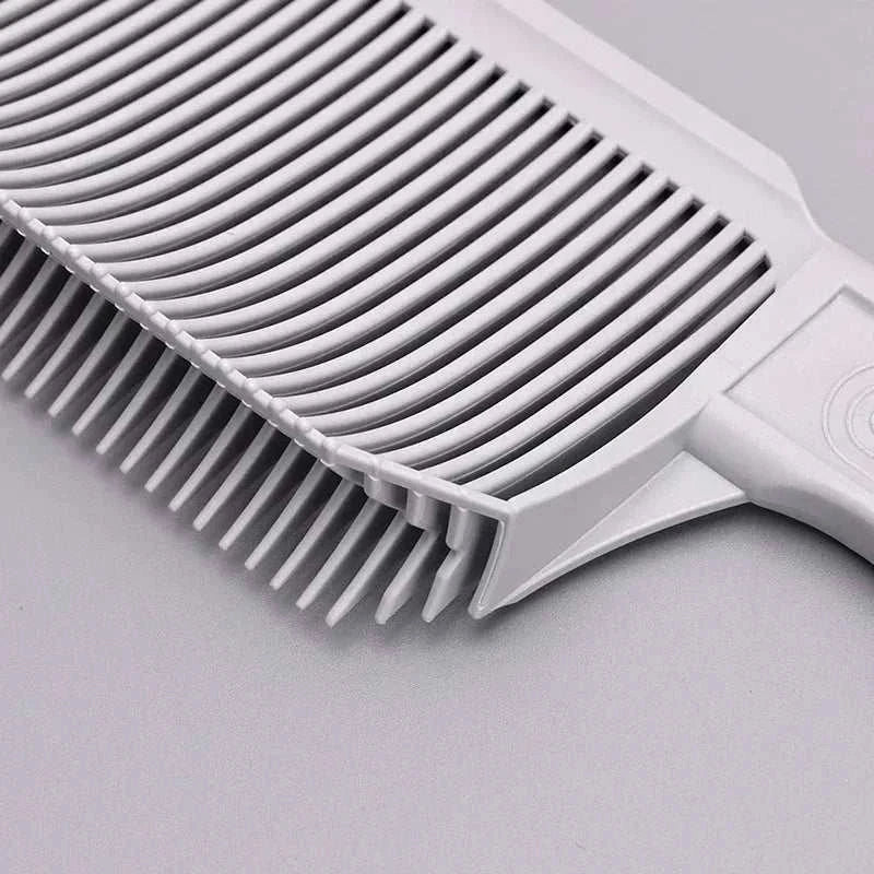 Professional-grade gray barber fade comb with precision gradient design for seamless fades and flat tops.