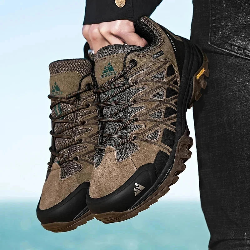 Men's Hiking Shoes in brown with durable construction, superior grip, breathable mesh, and cushioned midsoles for all-terrain outdoor adventures.
