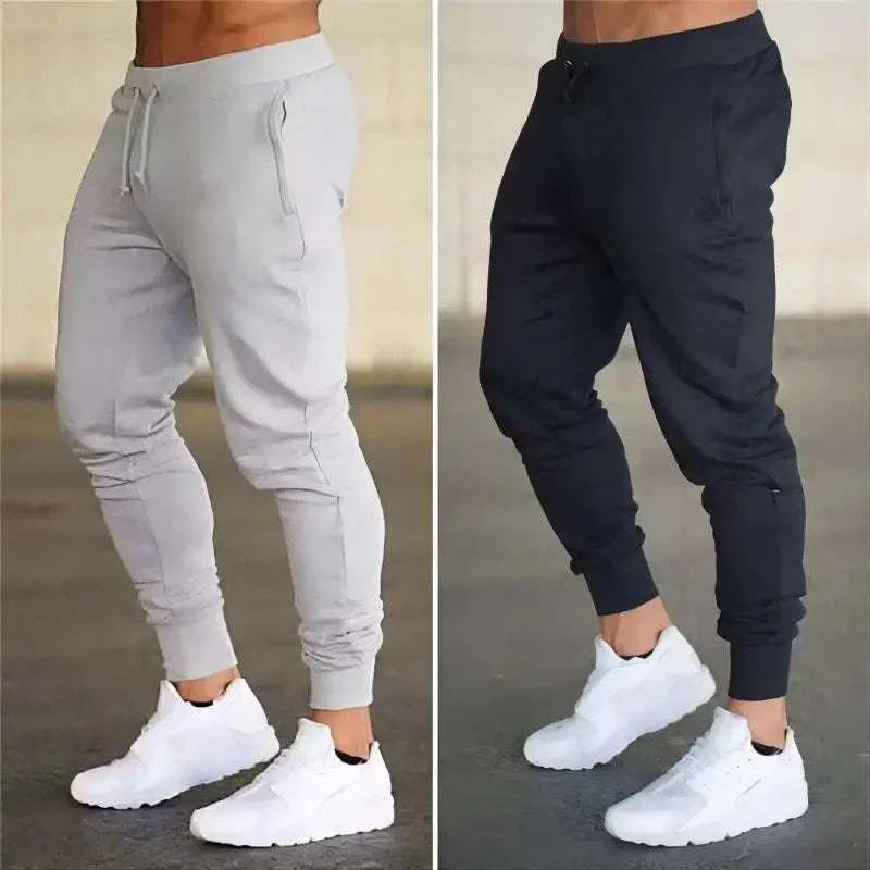 Men's Training Jogger Sweatpants in gray and black with tapered fit and elastic waistband for workout and casual wear