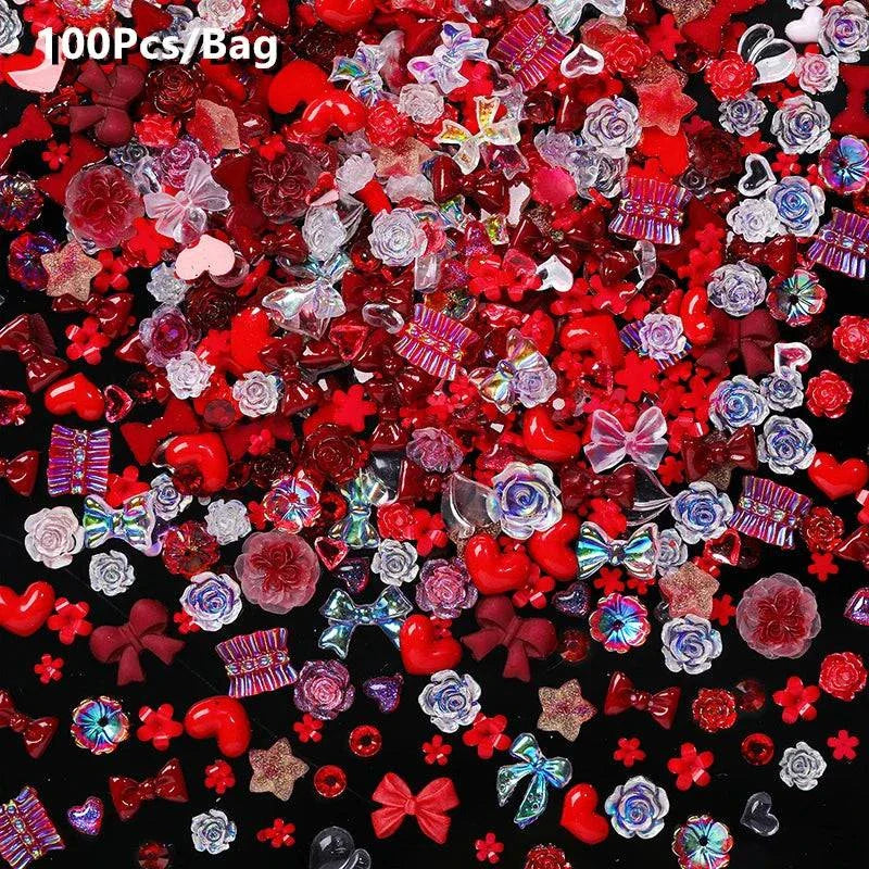 Assorted red and pink rhinestones, crystals, and nail art decorations for use with BORN PRETTY 10g Gel Nail Glue