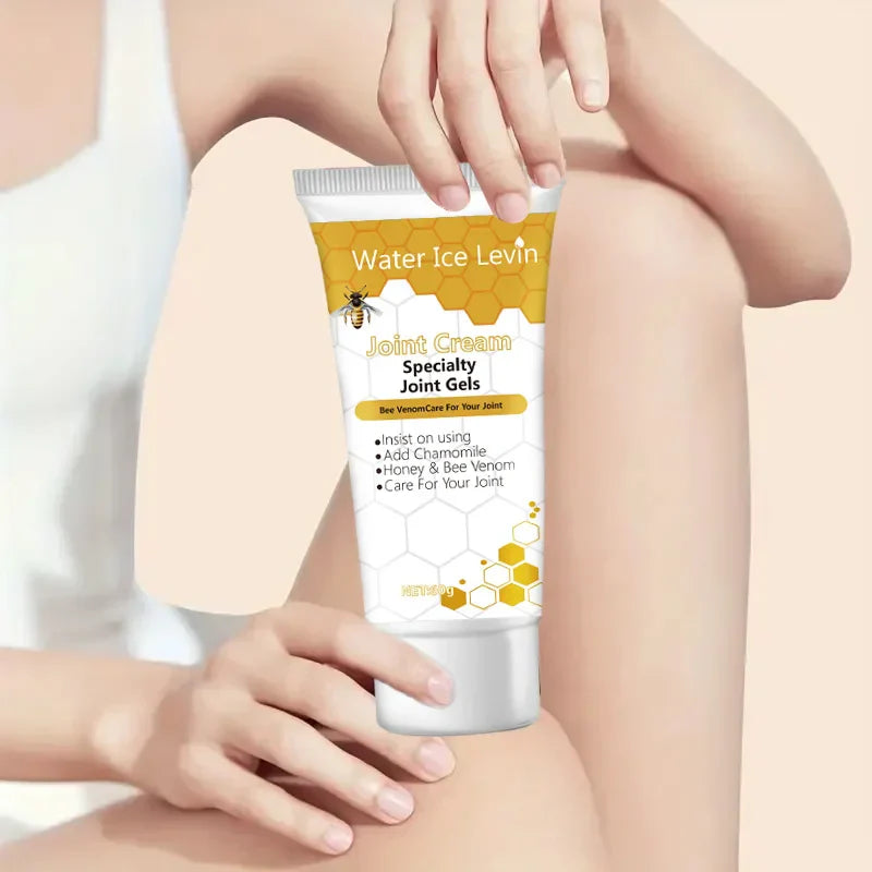 Bee Venom Joint Cream tube held on arm, natural anti-inflammatory joint relief gel