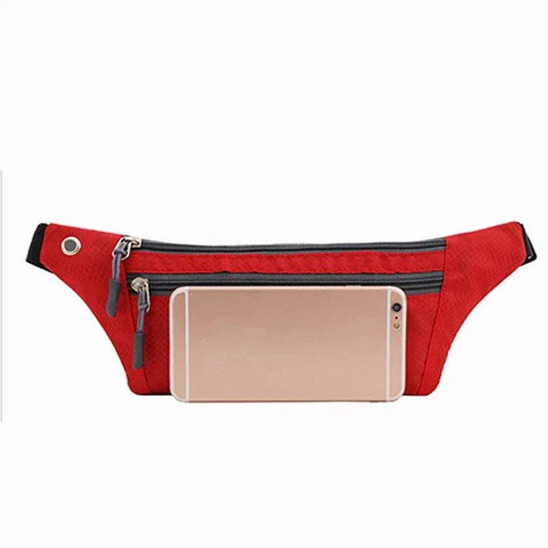 Red nylon waist and chest bag with multiple zippered compartments and adjustable strap, ideal for hands-free carrying of essentials during sports and travel.