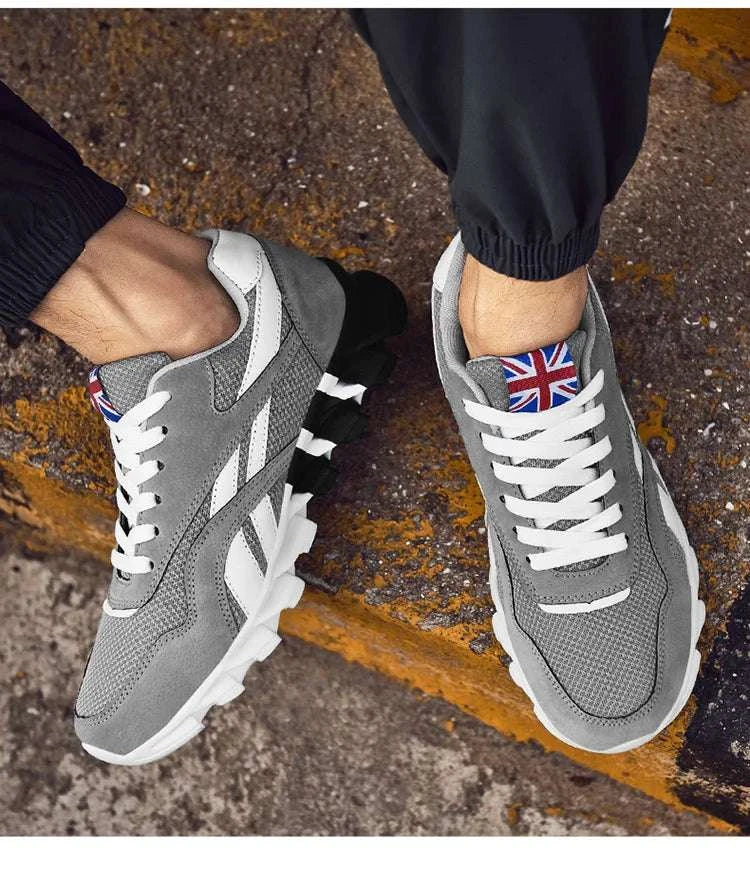 2025 new men's and women's running shoes in grey with breathable mesh, cushioned sole, anti-slip outsole, and UK flag detail on tongue