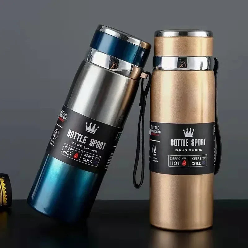 Pair of stylish hot and cold stainless steel thermos bottles in blue and gold with vacuum insulation and carrying straps