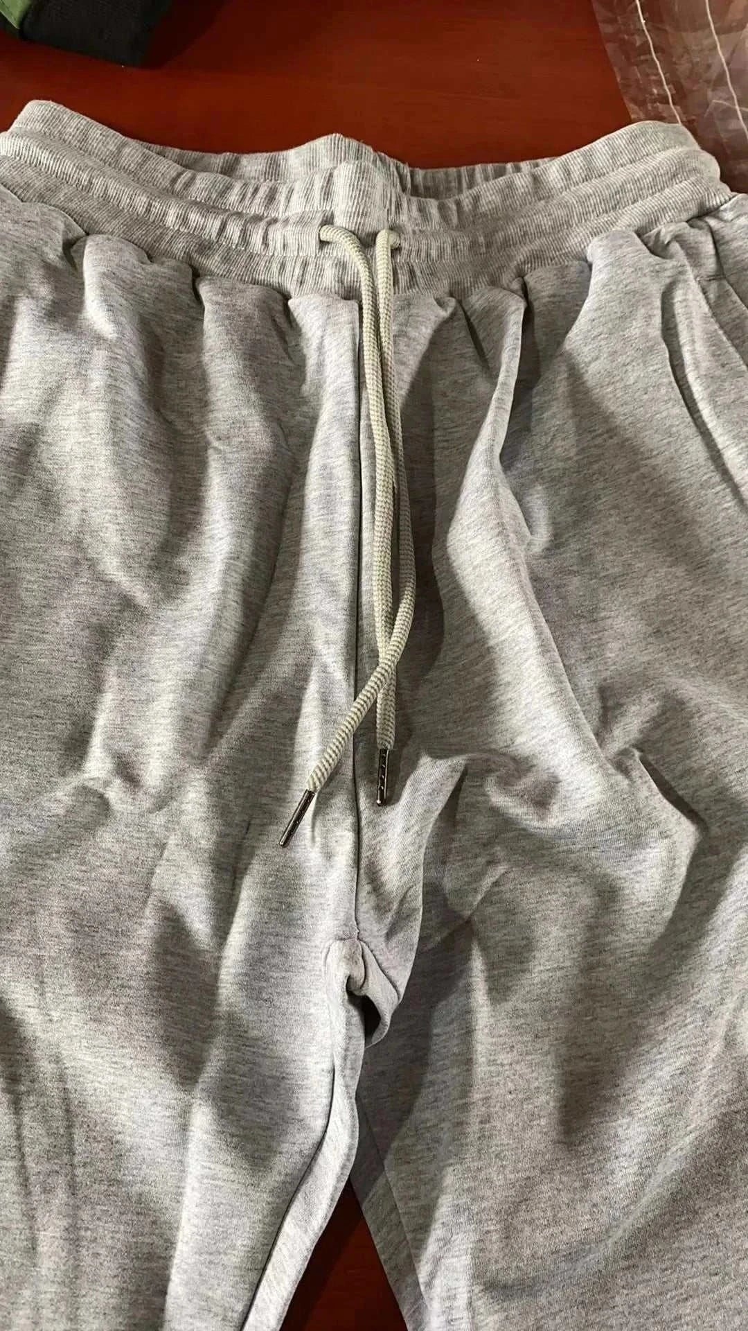 Men's Training Jogger Sweatpants in light gray with adjustable drawstring and elastic waistband for workout and casual wear