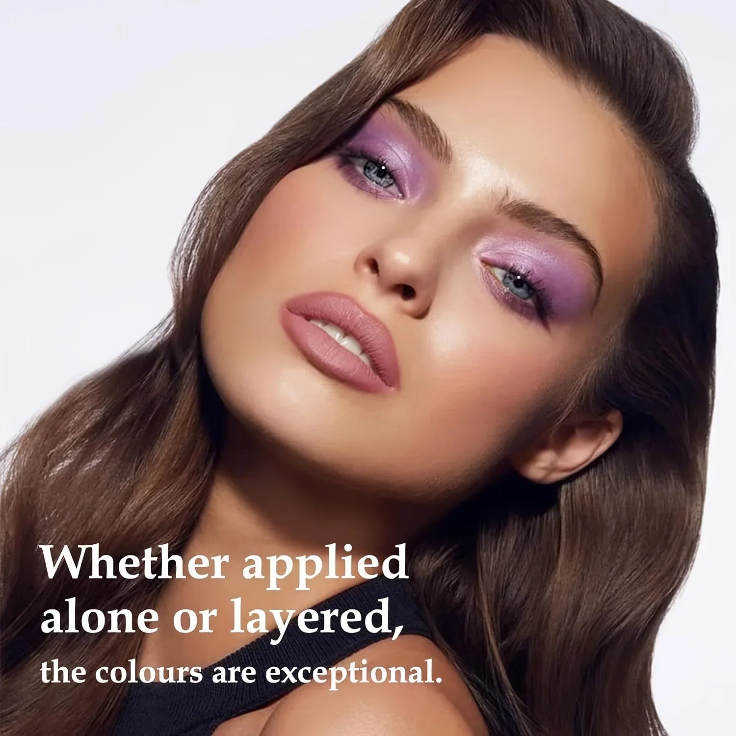 Close-up of a woman with pearlescent purple eyeshadow showcasing bold and shimmering eye makeup from a 16-color pearlescent glitter eyeliner set